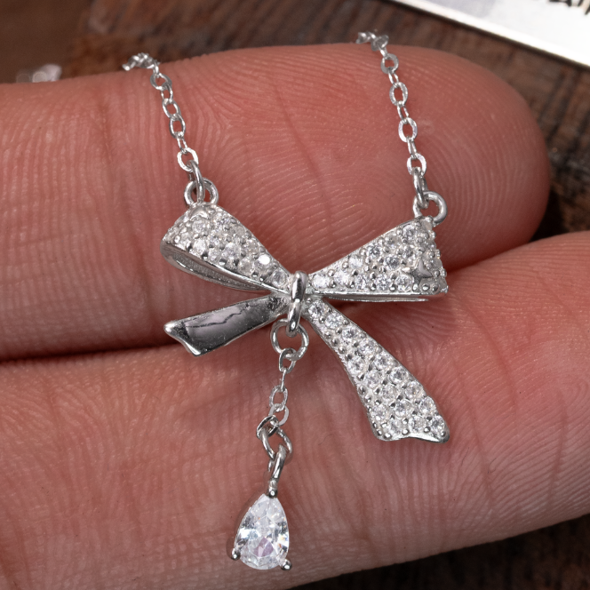 สร้อยคอรูปโบว์ – เงิน S999 – D401011